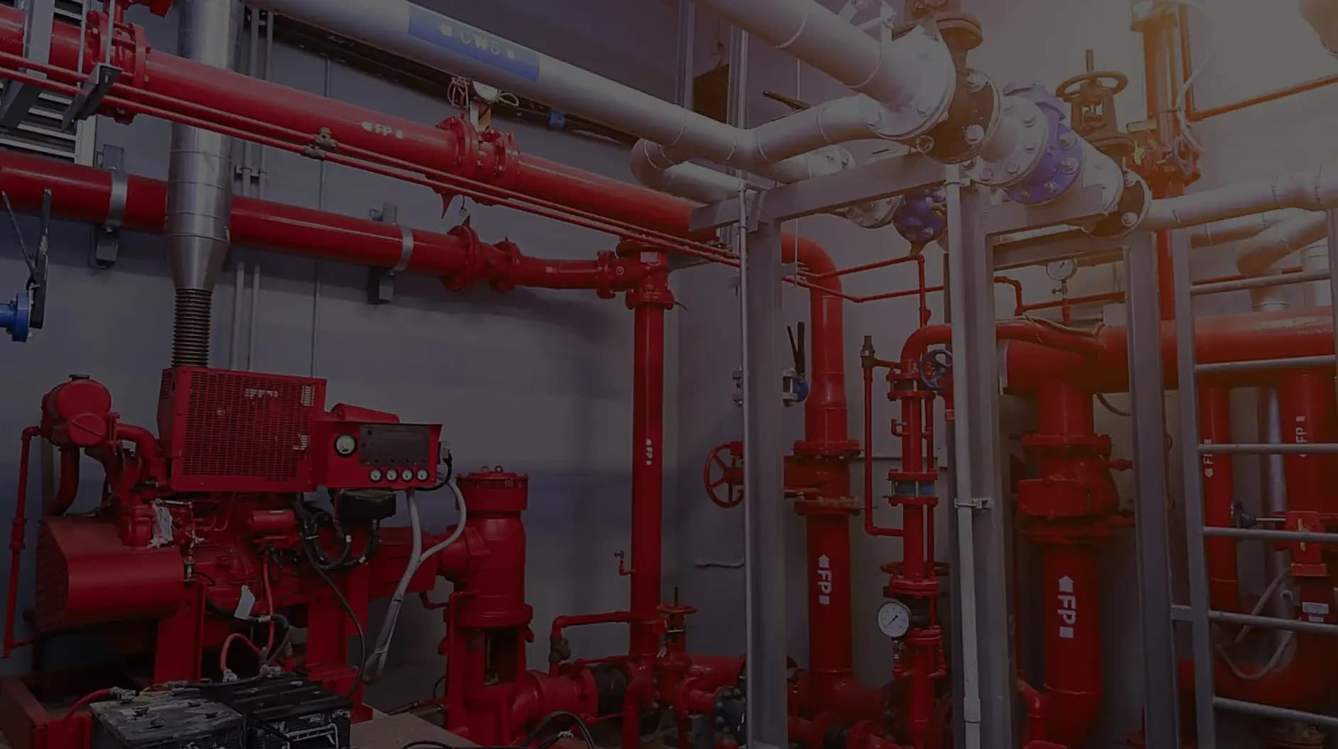 Fire pump room with red fire fighting pipework